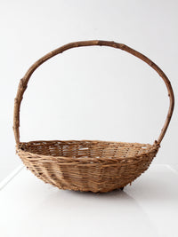 antique willow gathering basket with branch handle
