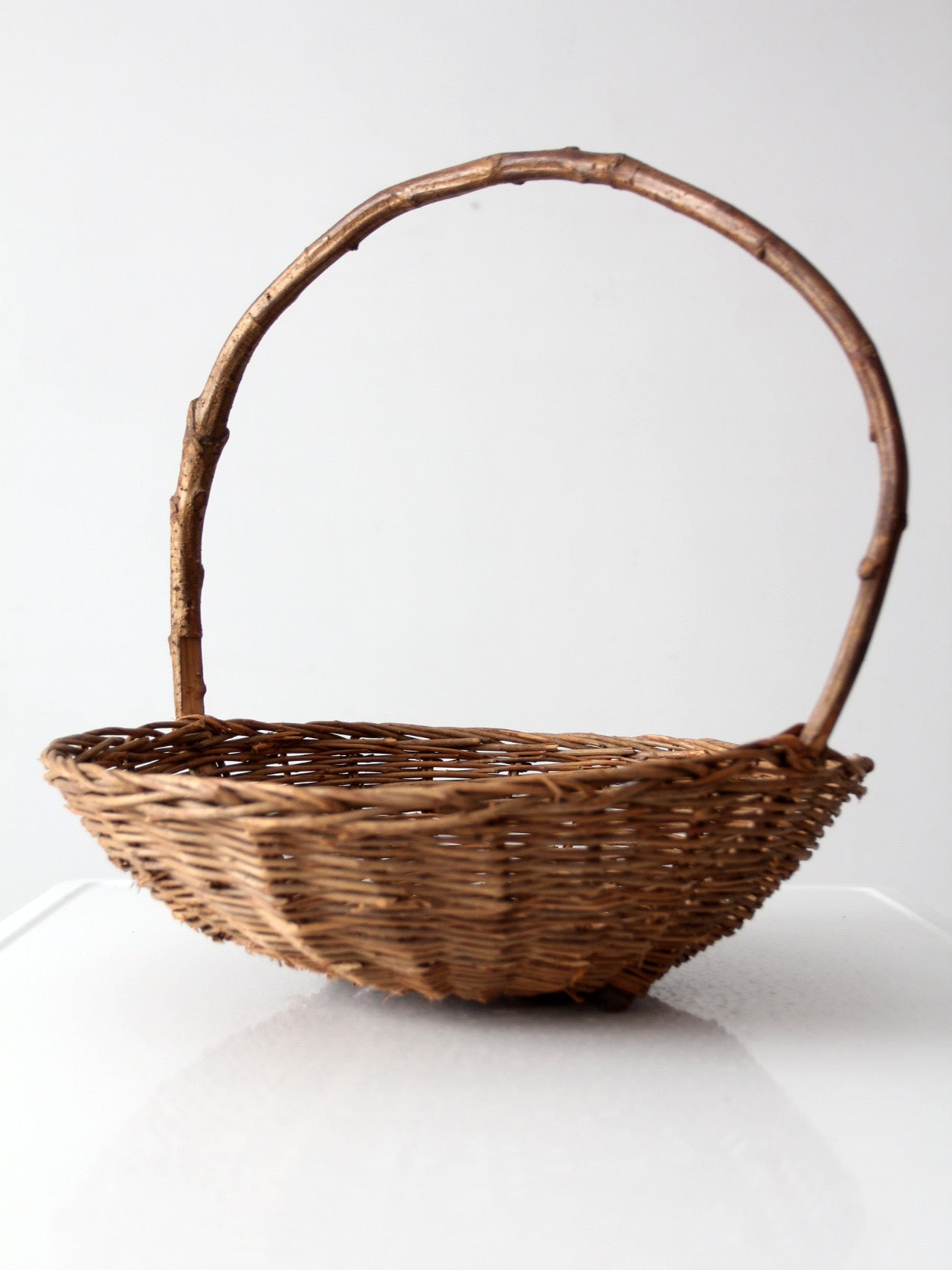 antique willow gathering basket with branch handle