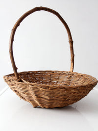 antique willow gathering basket with branch handle