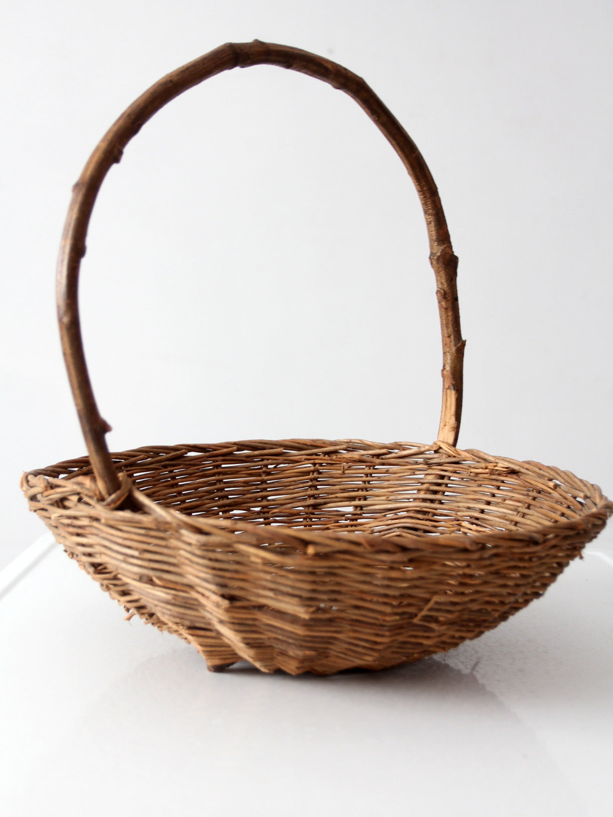 antique willow gathering basket with branch handle