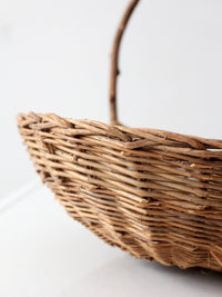 antique willow gathering basket with branch handle