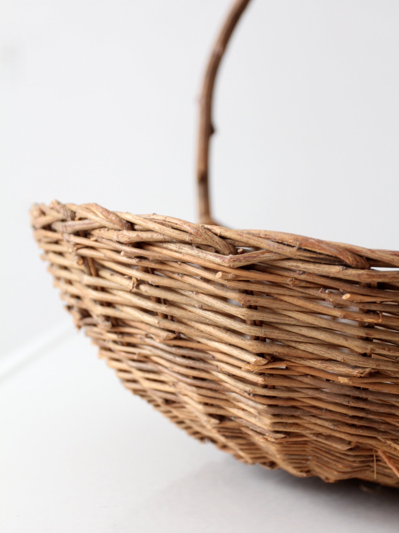 antique willow gathering basket with branch handle