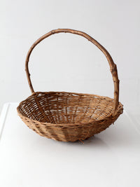antique willow gathering basket with branch handle