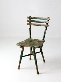 antique green painted rustic Adirondack chair