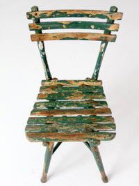 antique green painted rustic Adirondack chair