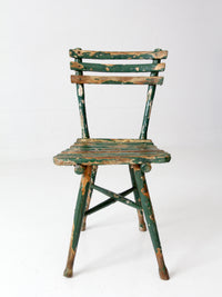 antique green painted rustic Adirondack chair