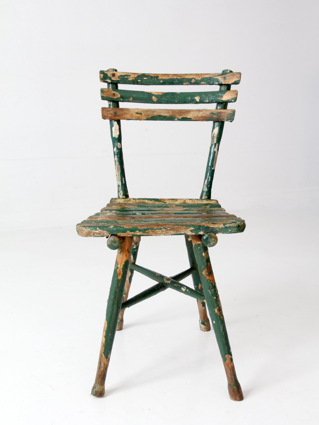 antique green painted rustic Adirondack chair
