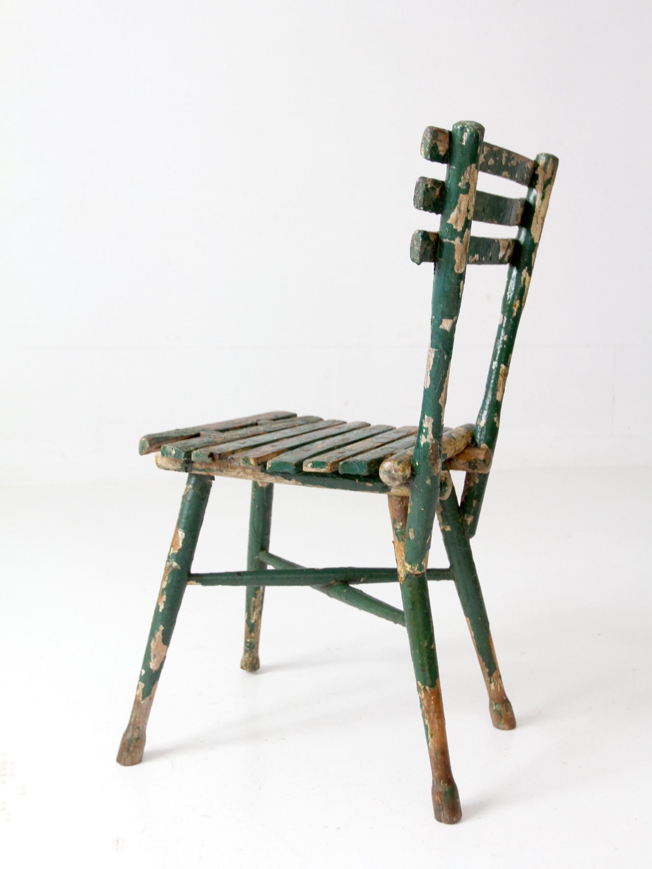 antique green painted rustic Adirondack chair