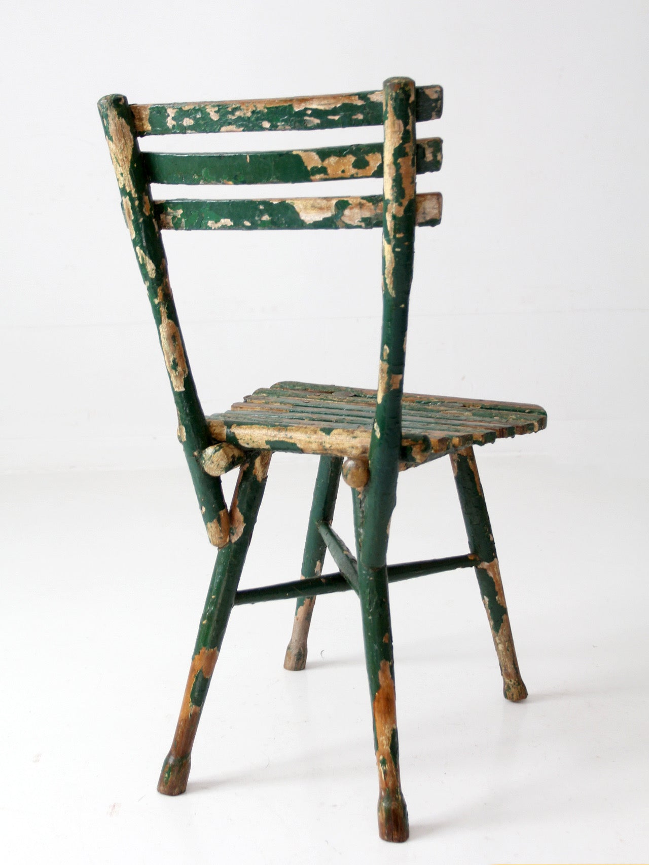 antique green painted rustic Adirondack chair