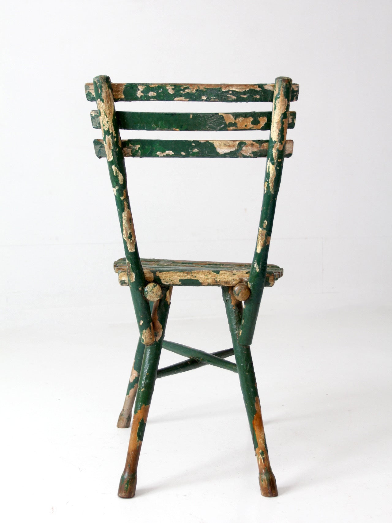 antique green painted rustic Adirondack chair