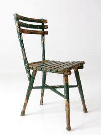 antique green painted rustic Adirondack chair