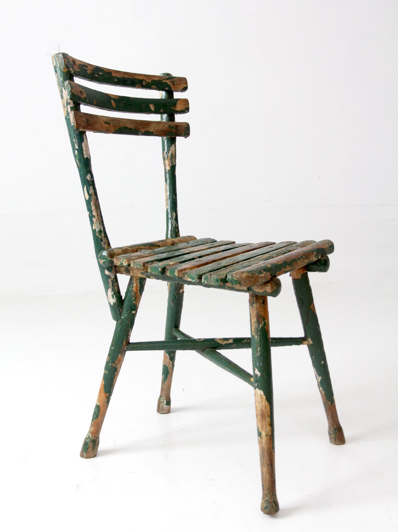 antique green painted rustic Adirondack chair