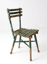 antique green painted rustic Adirondack chair