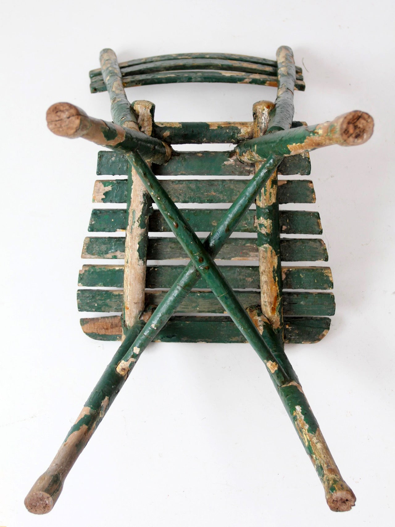 antique green painted rustic Adirondack chair