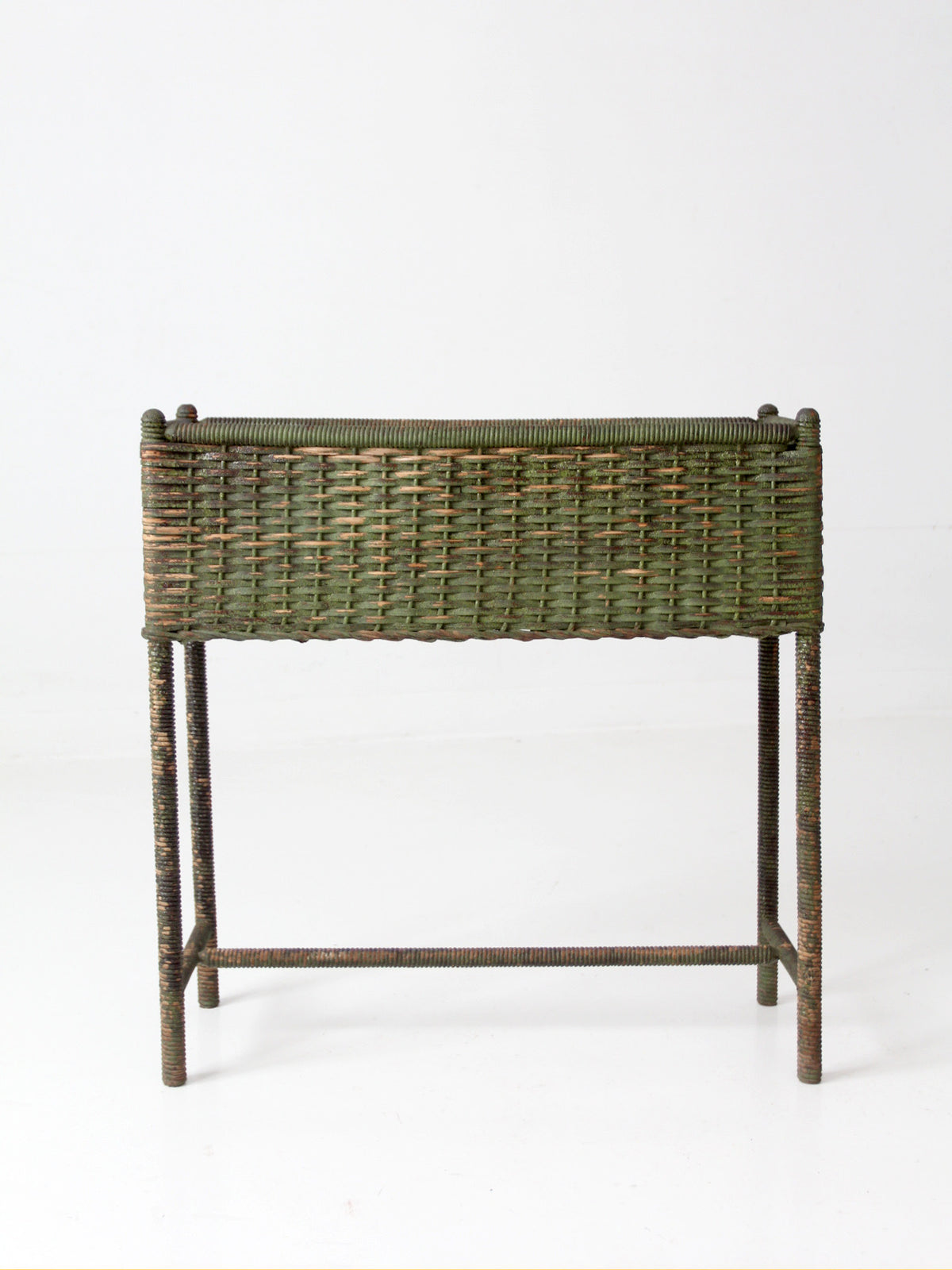 antique green painted wicker jardinière planter with metal liner