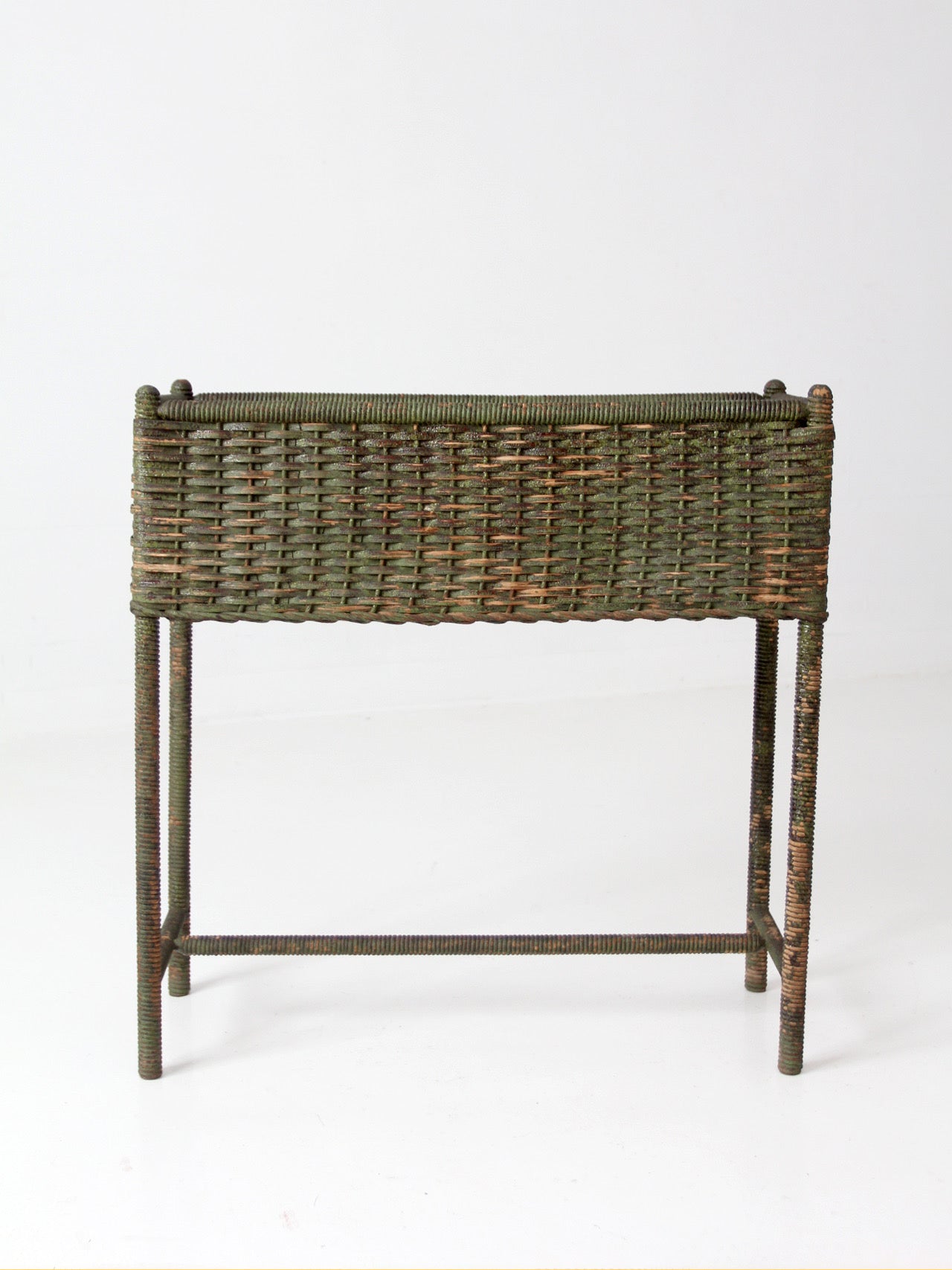 antique green painted wicker jardinière planter with metal liner