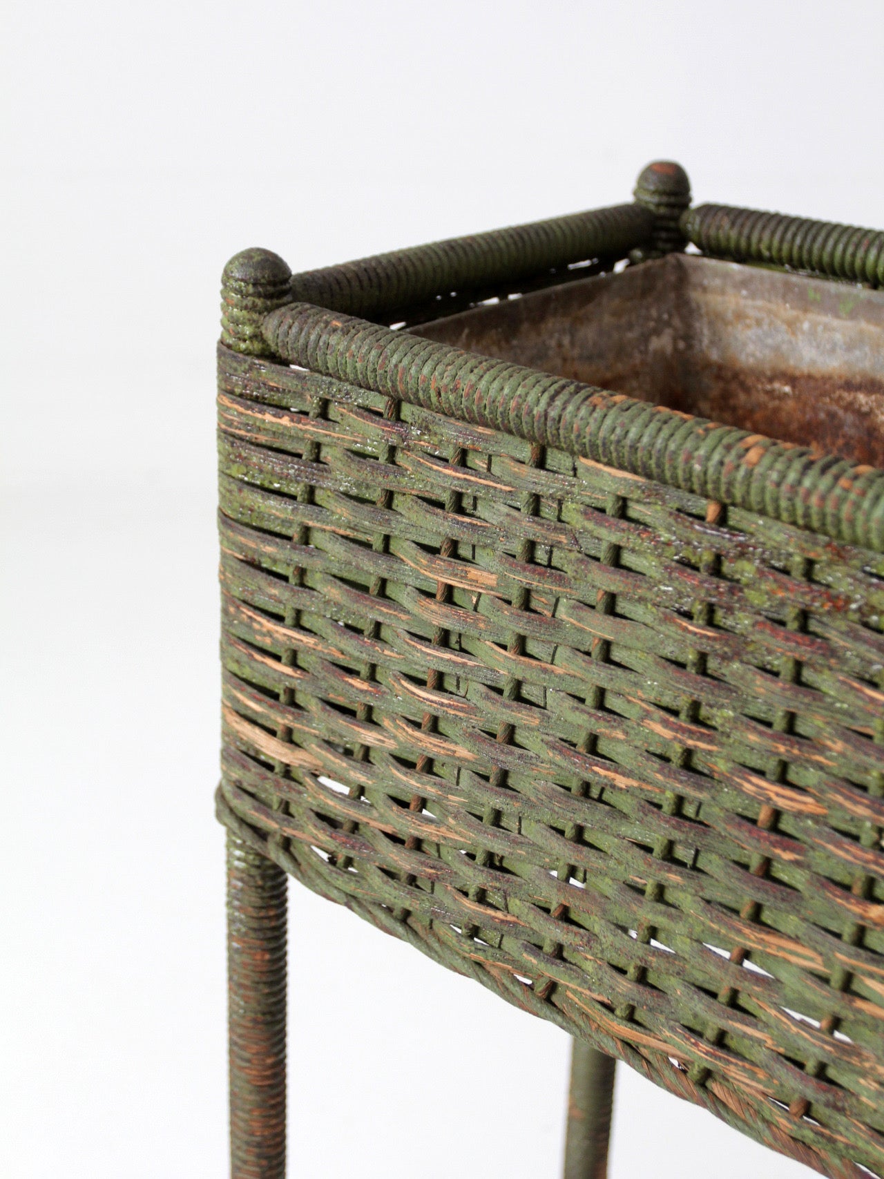 antique green painted wicker jardinière planter with metal liner