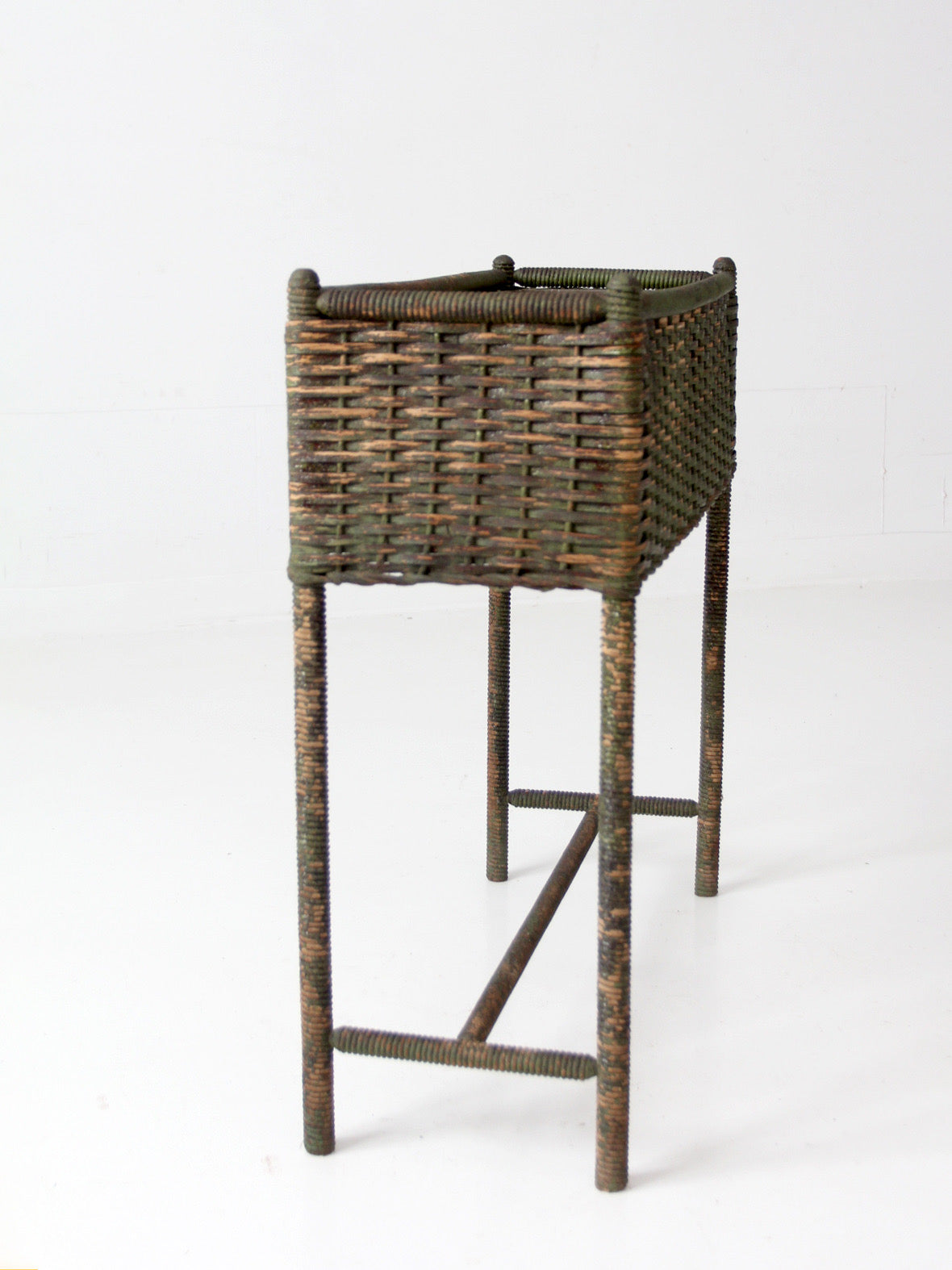 antique green painted wicker jardinière planter with metal liner