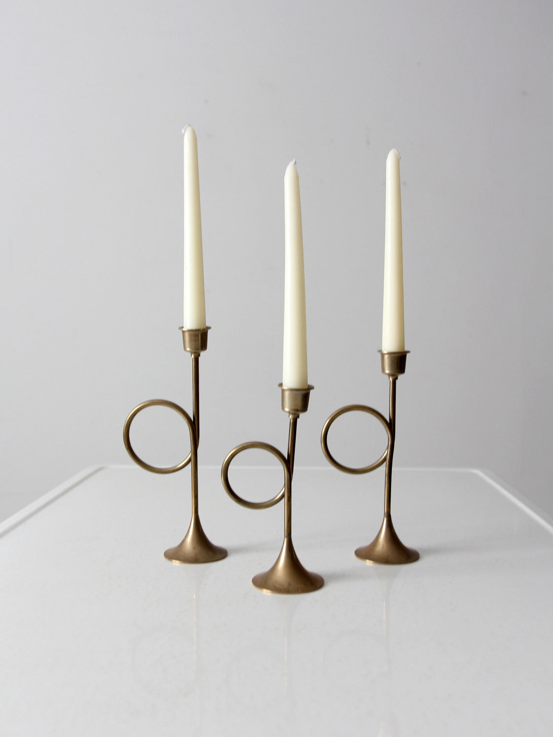 vintage modernist brass loop candlesticks | set of three