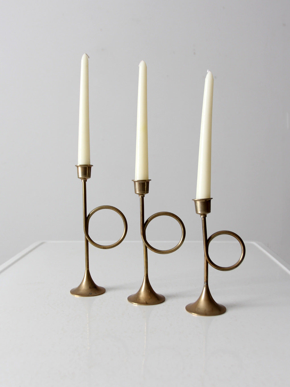 vintage modernist brass loop candlesticks | set of three