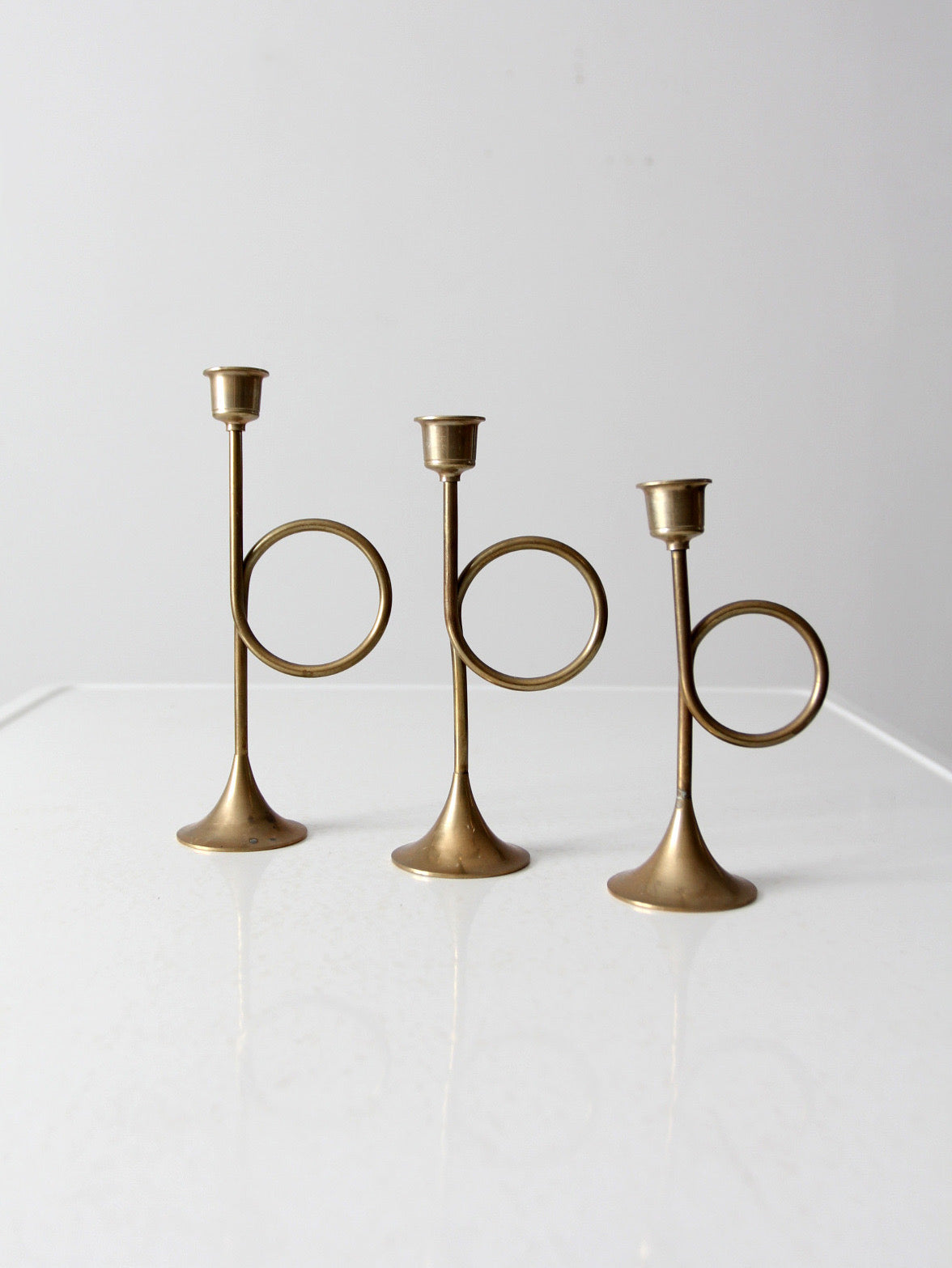 vintage modernist brass loop candlesticks | set of three