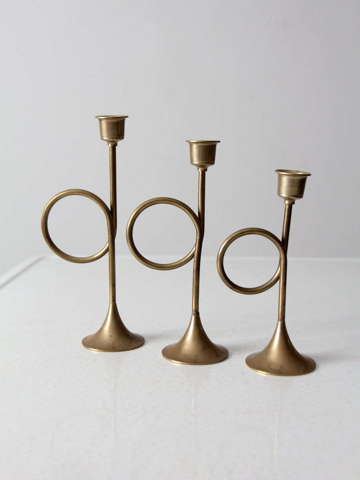 vintage modernist brass loop candlesticks | set of three