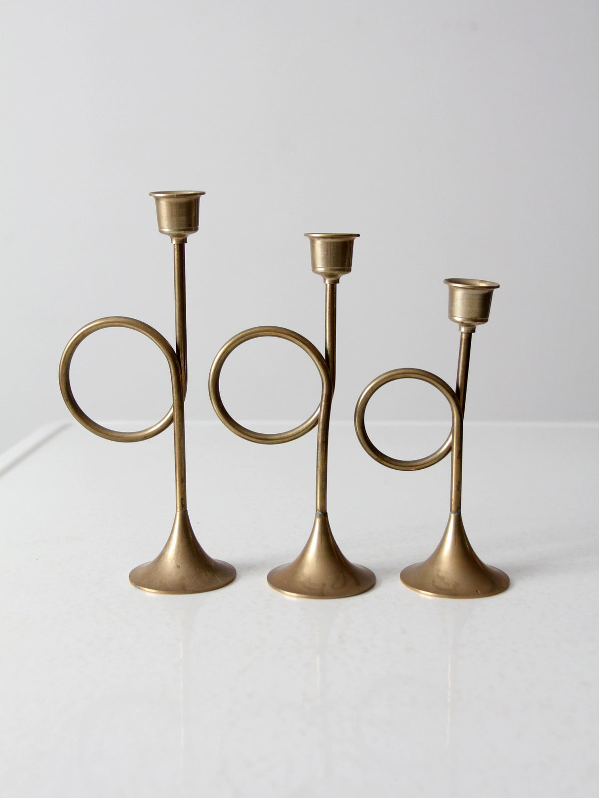 vintage modernist brass loop candlesticks | set of three