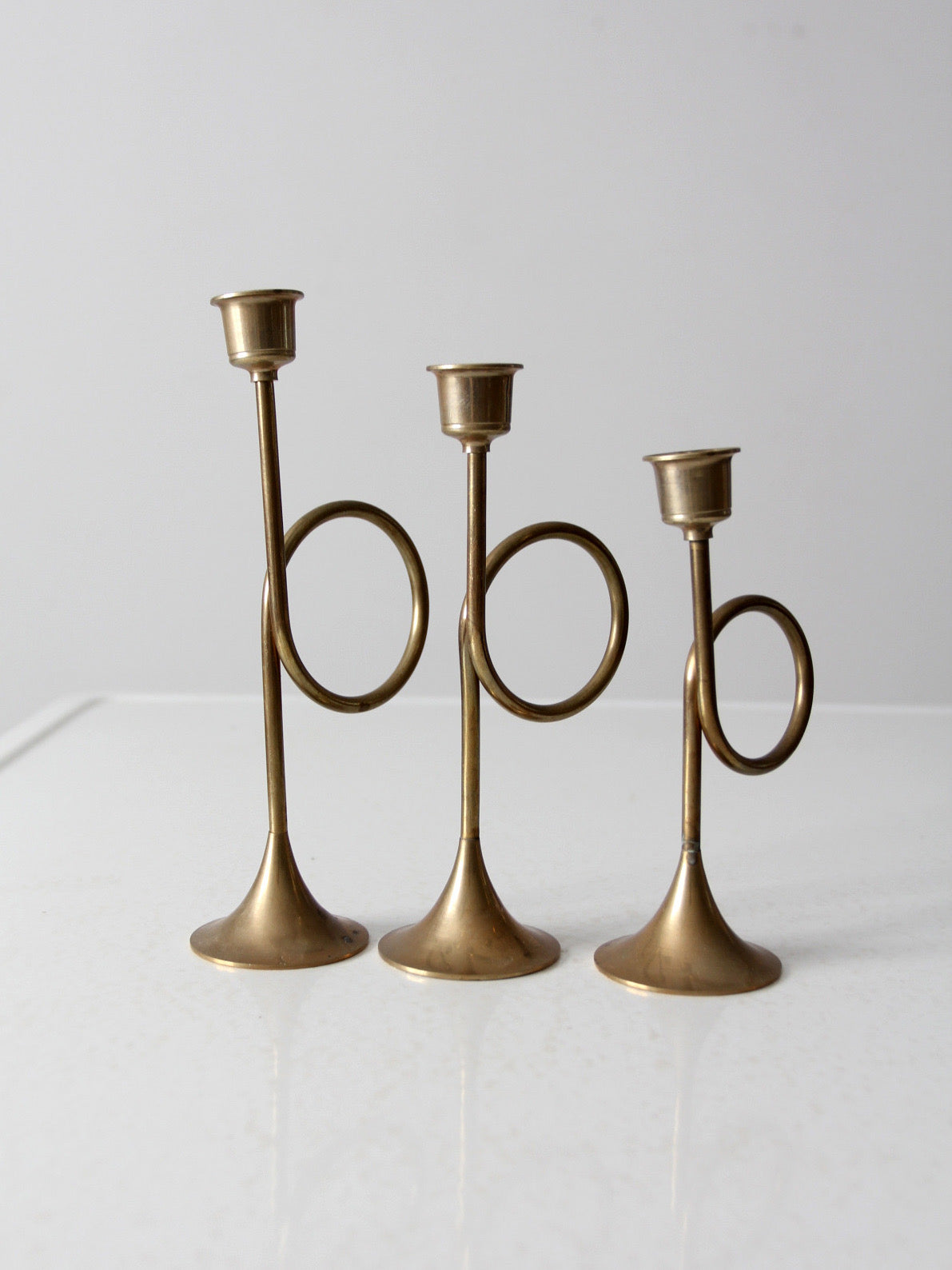 vintage modernist brass loop candlesticks | set of three