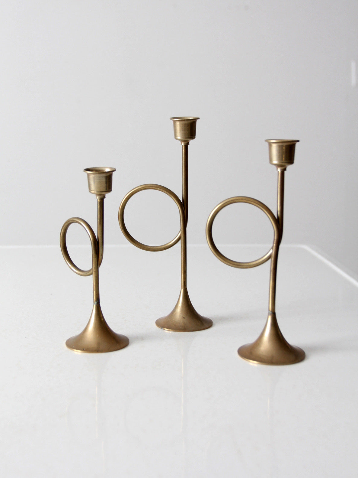 vintage modernist brass loop candlesticks | set of three