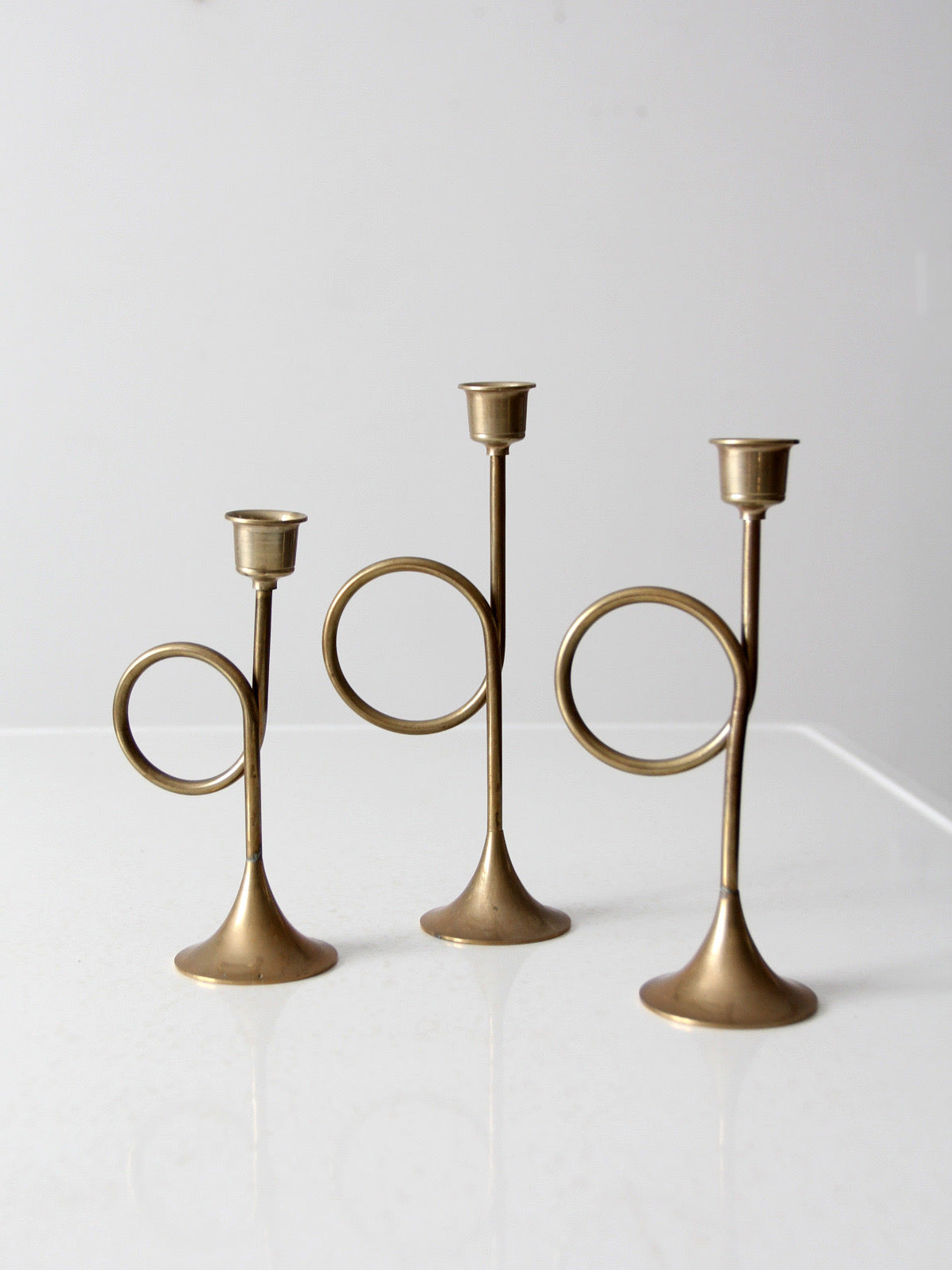 vintage modernist brass loop candlesticks | set of three
