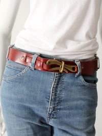 vintage leather belt with sculptural brass hook buckle