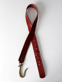 vintage leather belt with sculptural brass hook buckle