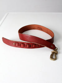 vintage leather belt with sculptural brass hook buckle