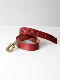 vintage leather belt with sculptural brass hook buckle