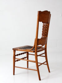 antique Victorian Eastlake chair with embossed leather seat