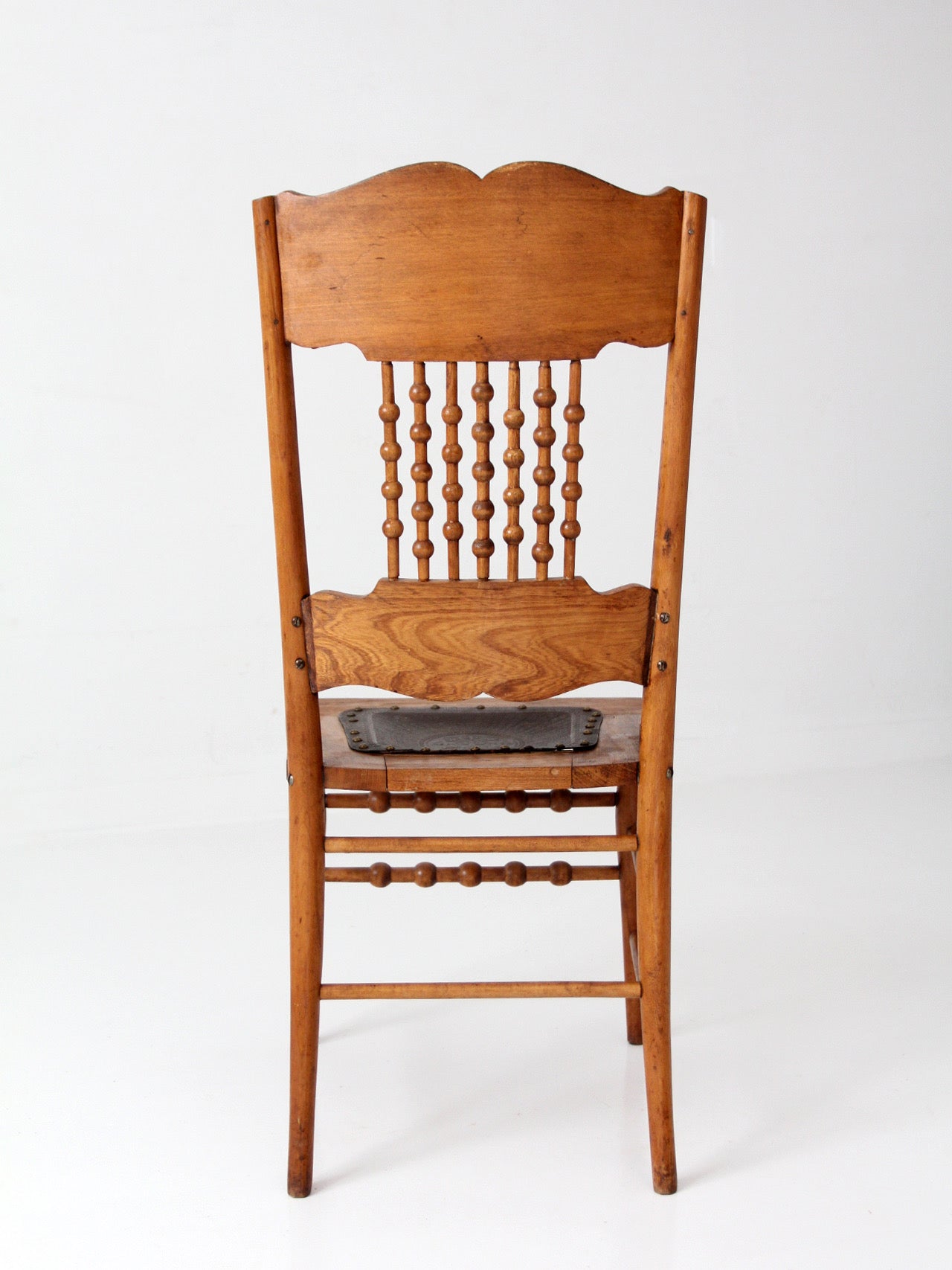 antique Victorian Eastlake chair with embossed leather seat