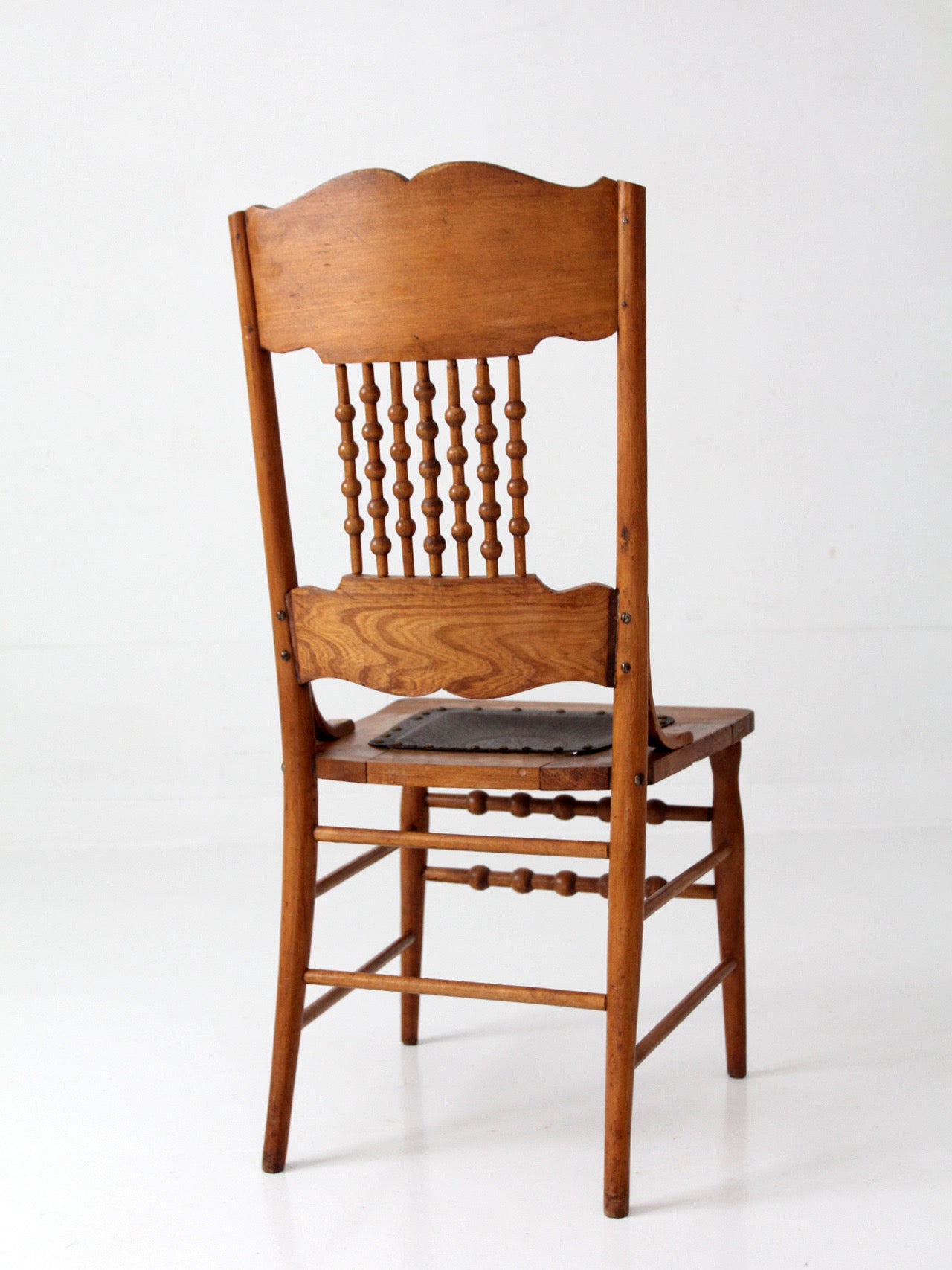 antique Victorian Eastlake chair with embossed leather seat