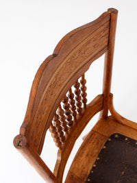 antique Victorian Eastlake chair with embossed leather seat