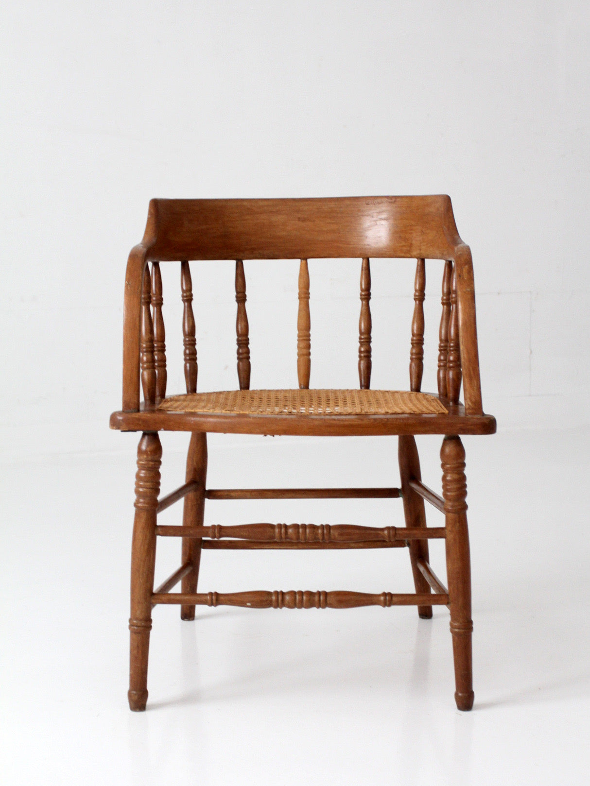 antique cane seat captain's chair