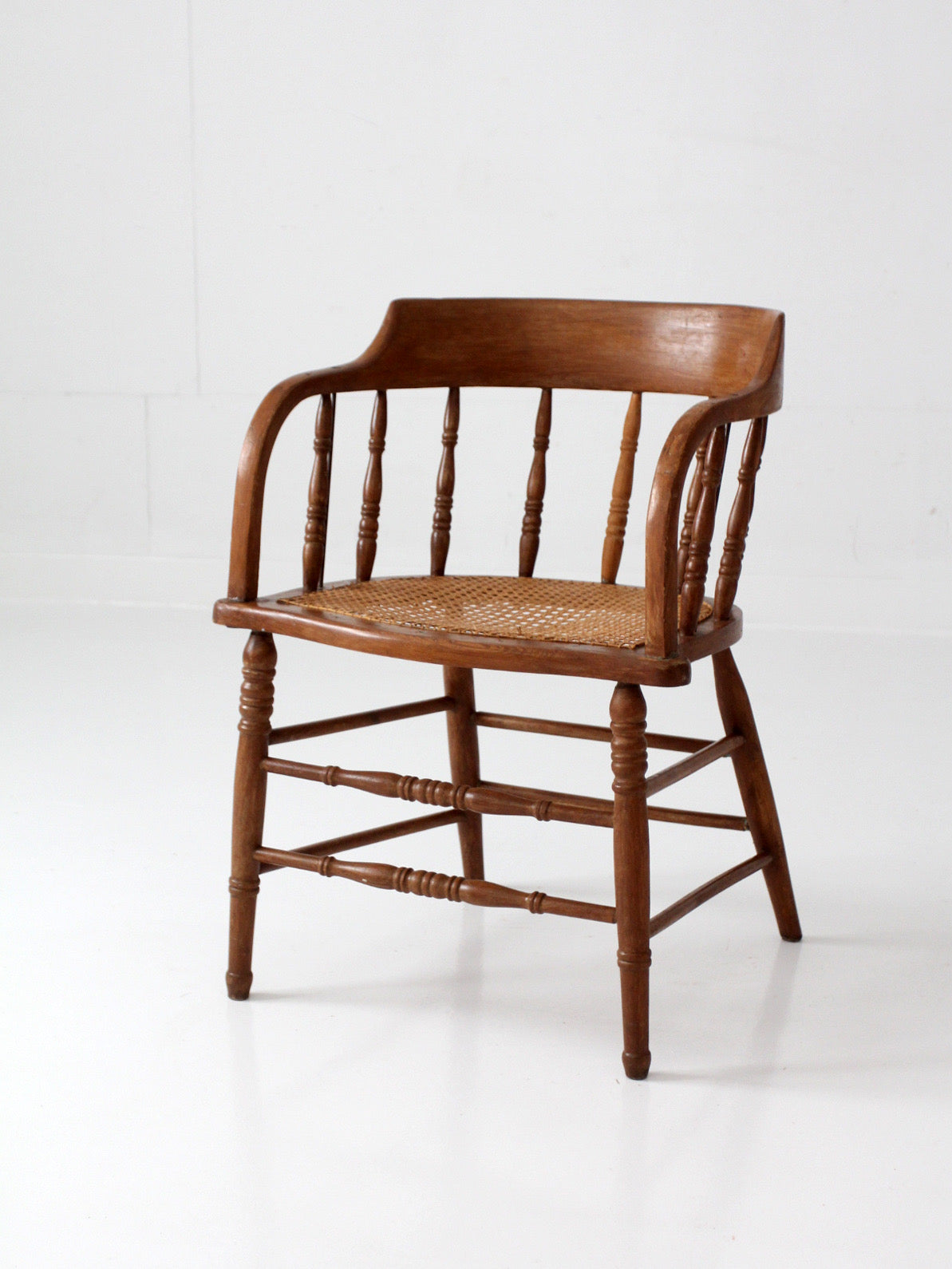 antique cane seat captain's chair