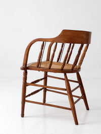 antique cane seat captain's chair
