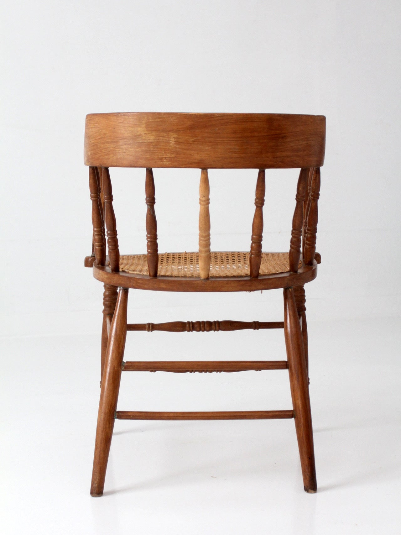 antique cane seat captain's chair
