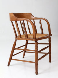 antique cane seat captain's chair