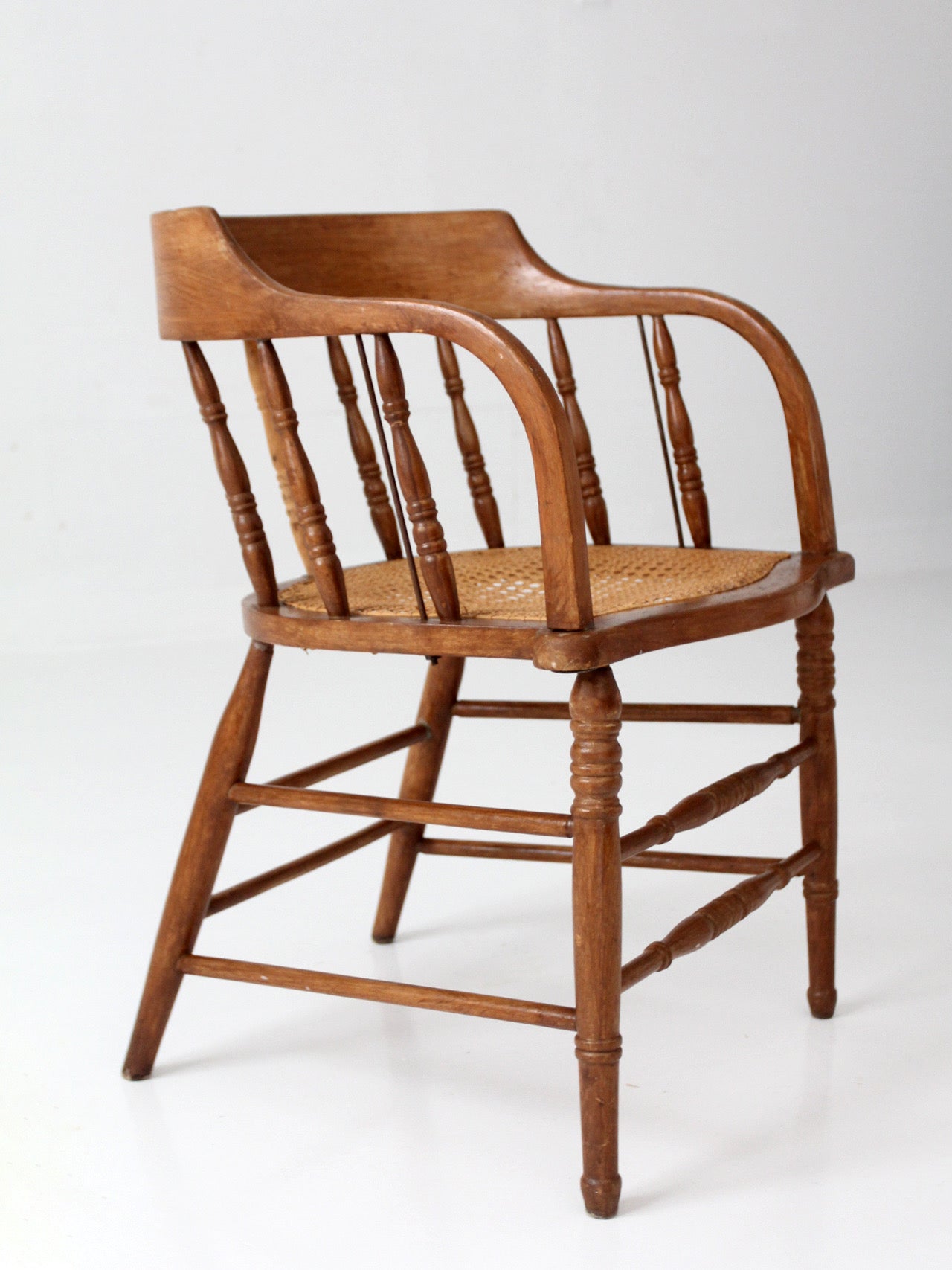 antique cane seat captain's chair