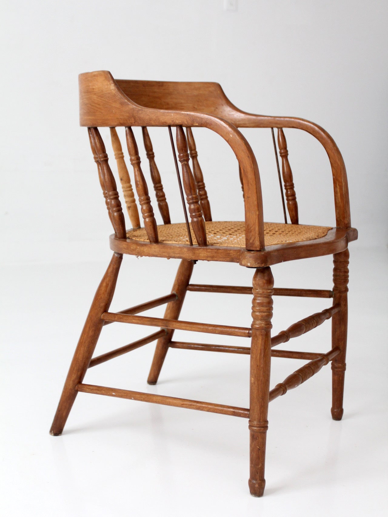 antique cane seat captain's chair