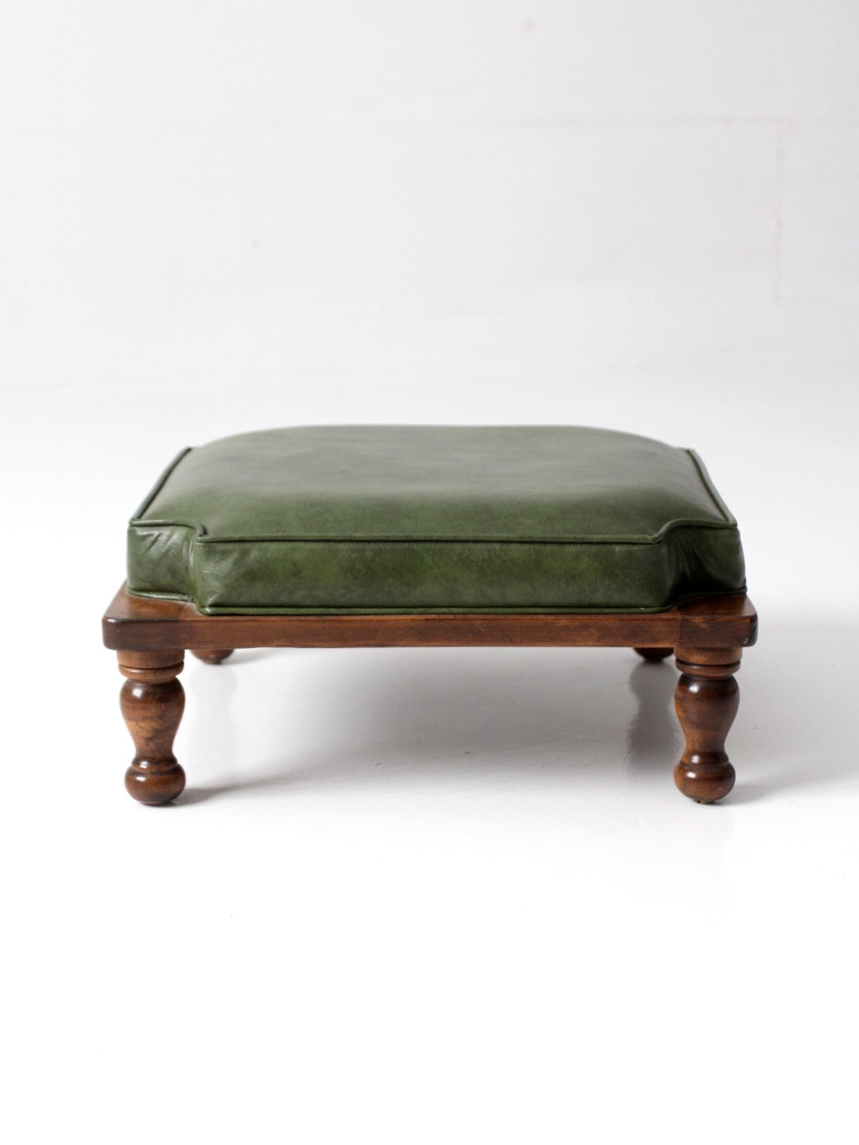 mid-century Colonial Revival footstool with green cushion