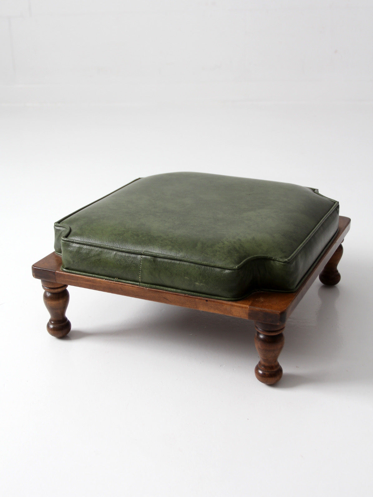 mid-century Colonial Revival footstool with green cushion
