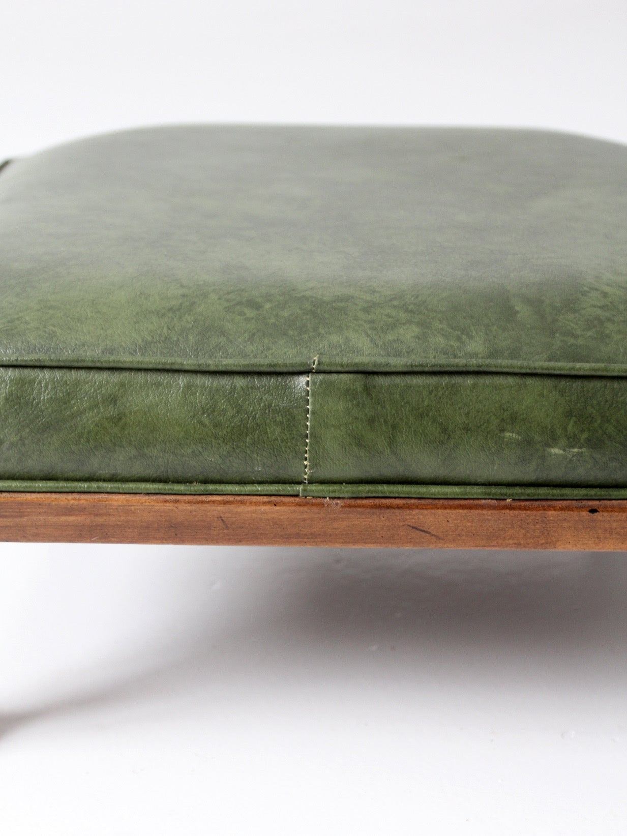 mid-century Colonial Revival footstool with green cushion