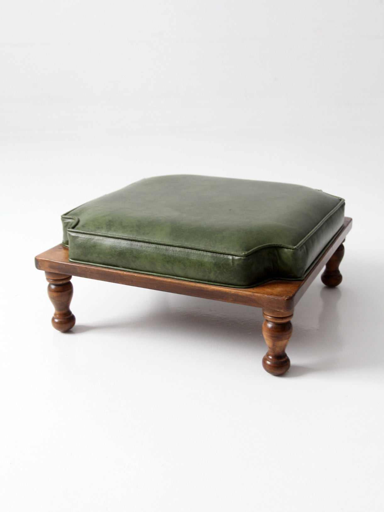 mid-century Colonial Revival footstool with green cushion