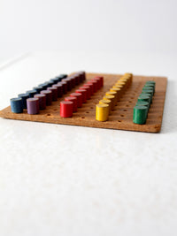 mid-century wooden peg board toy